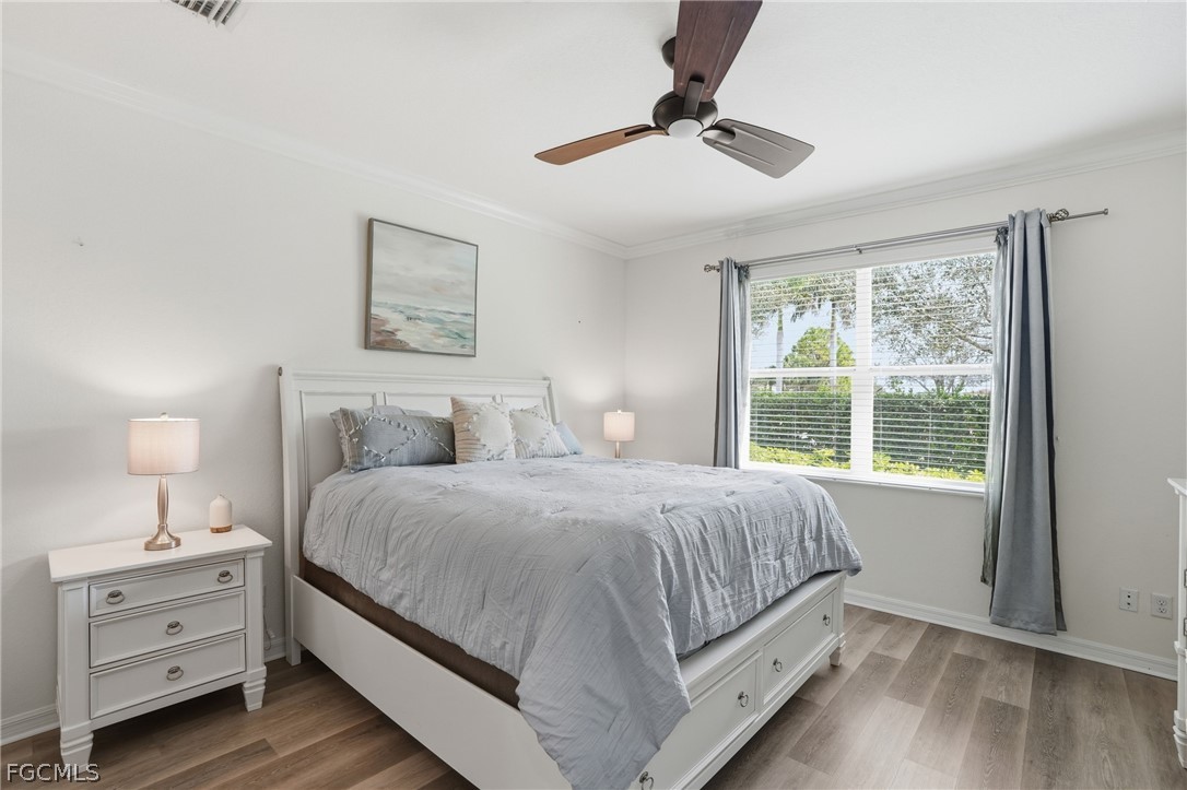 1936 Wellington Street Naples, FL 34120 - Photo 14 of 27 a bedroom with a bed and a window