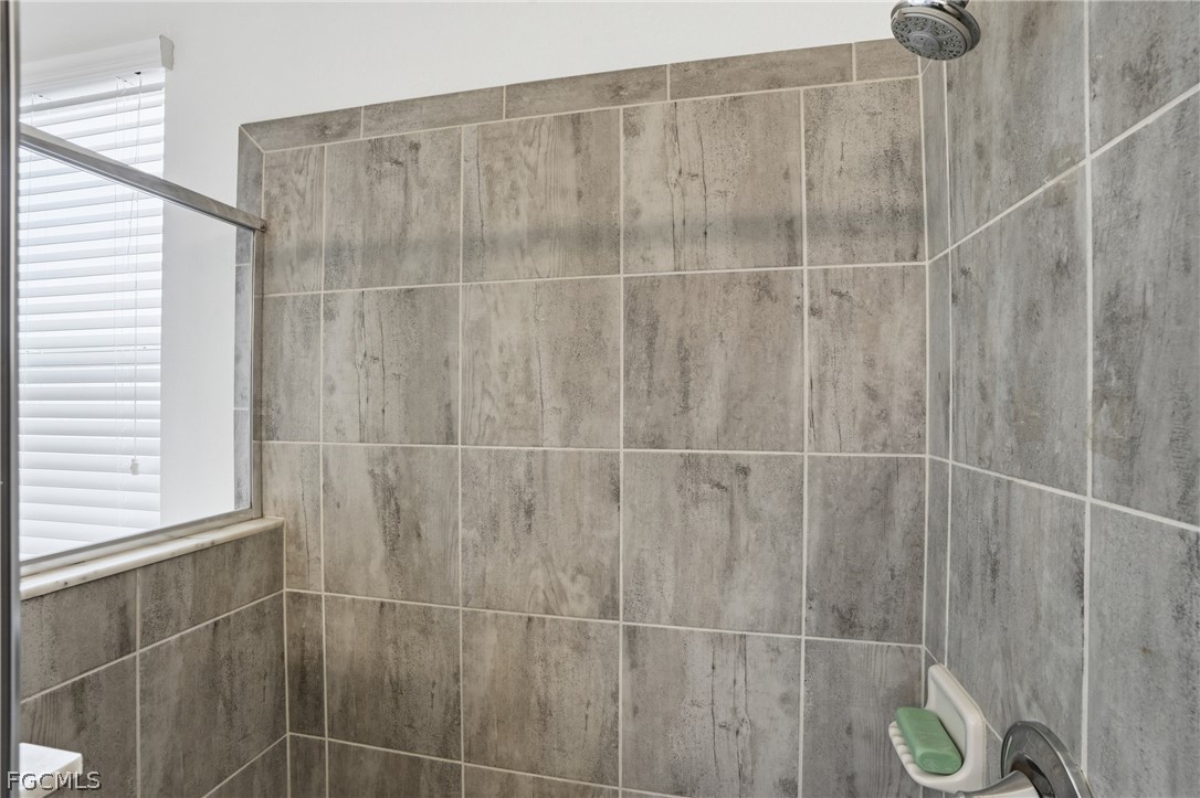 1936 Wellington Street Naples, FL 34120 - Photo 17 of 27 a bathroom with a shower