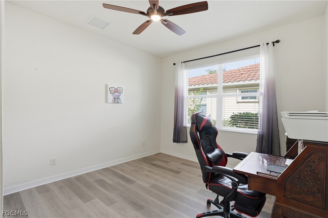 1936 Wellington Street Naples, FL 34120 - Photo 23 of 27 a workspace with furniture and a window