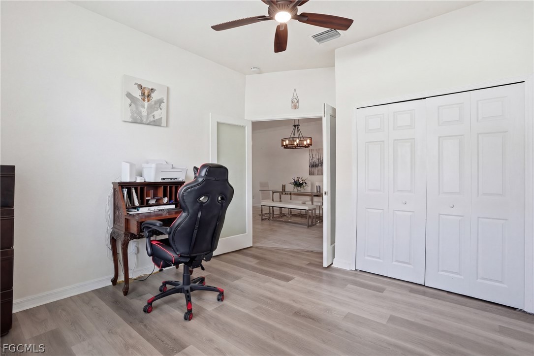 1936 Wellington Street Naples, FL 34120 - Photo 24 of 27 a view of a workspace with furniture and wooden floor