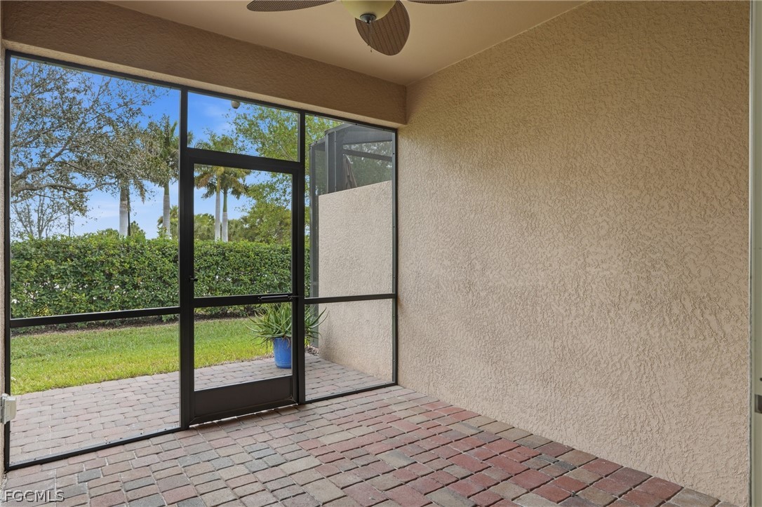 1936 Wellington Street Naples, FL 34120 - Photo 25 of 27 a view of a room with wooden floor and a floor to ceiling window