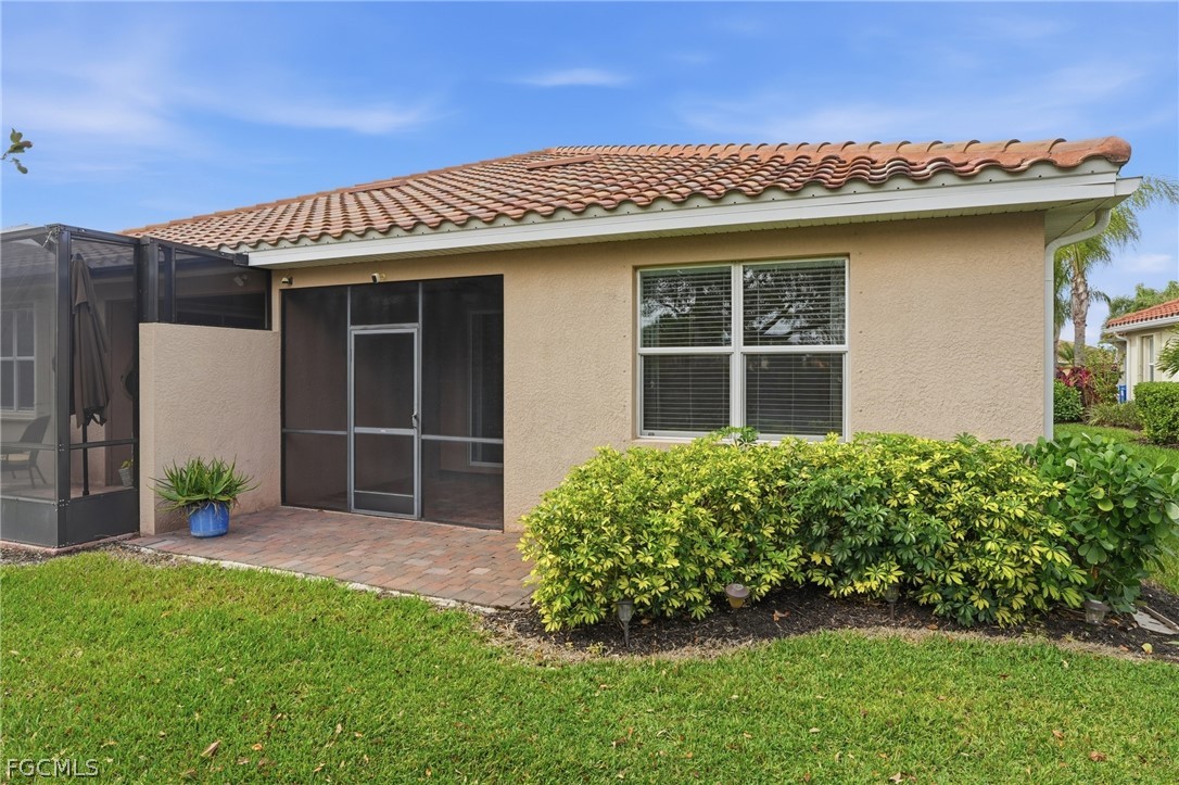 1936 Wellington Street Naples, FL 34120 - Photo 27 of 27 a front view of a house with a garden