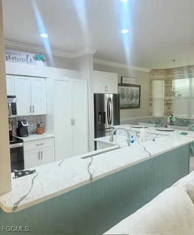 a bathroom with a sink double vanity granite and a bathtub