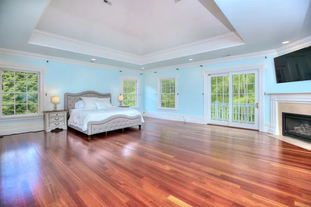 a view of a livingroom with furniture and a fireplace
