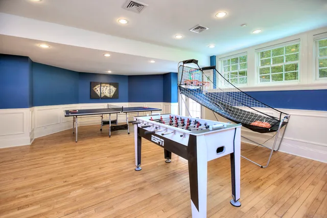 a view of a room with wooden floor and windows