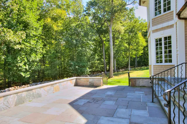 a view of swimming pool with sitting area