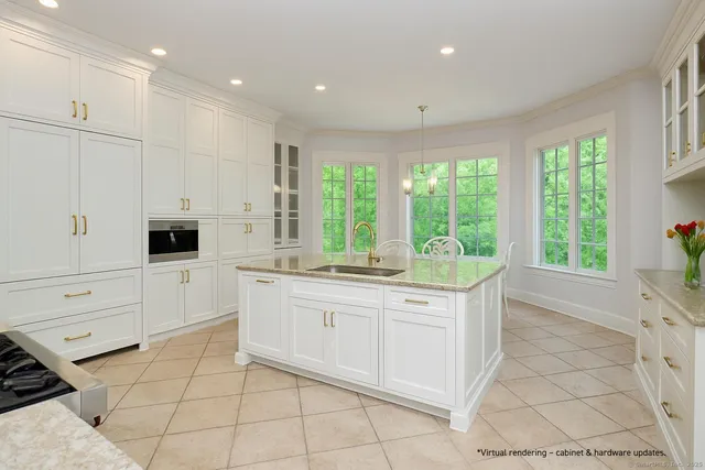 a large white kitchen with a large window