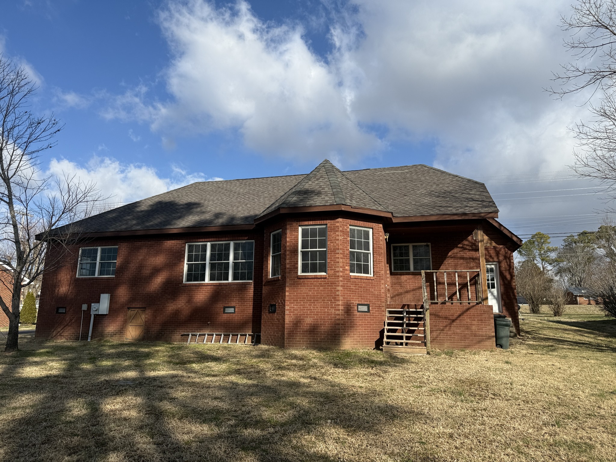 313 Murfreesboro Road Woodbury, TN 37190 - Photo 3 of 8 a view of a house with a yard