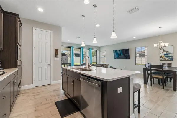 a view of walk in closet with clothes