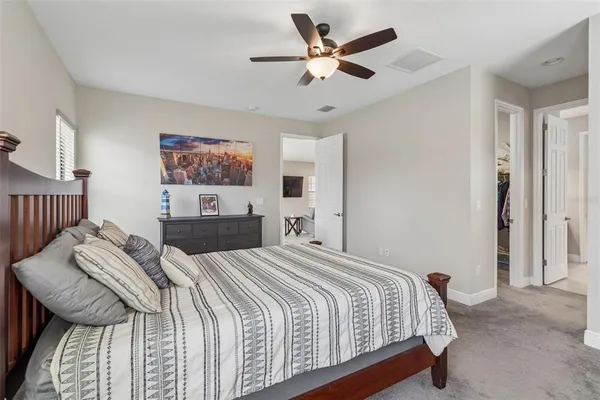 a bathroom with a granite countertop shower and a sink