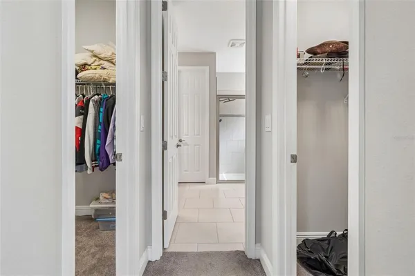 a bathroom with a granite countertop sink a mirror and a shower