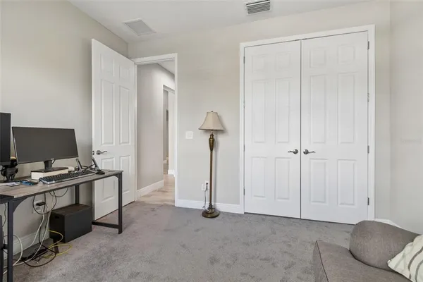 a view of an empty room with a floor to ceiling window