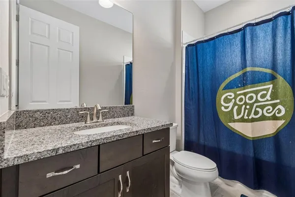 a view of an house with backyard space and porch