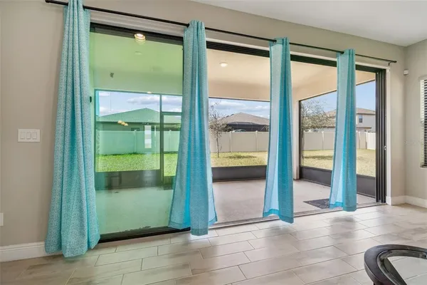 an aerial view of a house with pool and ocean view