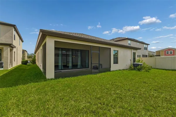 an aerial view of a house with a swimming pool outdoor seating and entertaining space