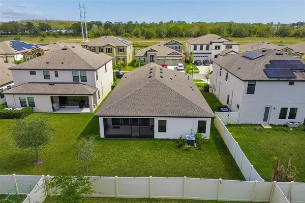 a view of a lake with a house swimming pool and outdoor space