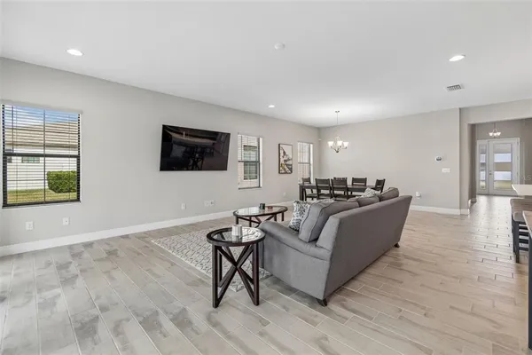 a large kitchen with a table and chairs in it