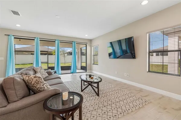 a kitchen with a sink a counter top space stainless steel appliances and cabinets