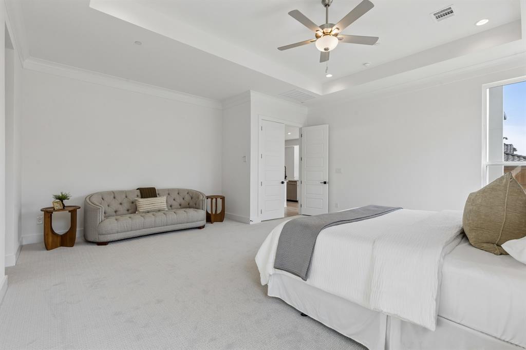 460 Harrison Lane Prosper, TX 75078 - Photo 19 of 40 Tray ceiling with recessed lighting, ceiling fan, white paneled doors, and carpet flooring