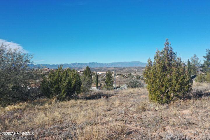 3570 Warrior Rest, Unit 132 Rimrock, AZ 86335 - Photo 11 of 31 a view of a dry yard with mountains in the background