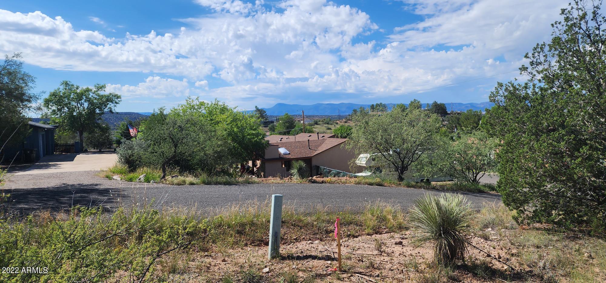 3570 Warrior Rest, Unit 132 Rimrock, AZ 86335 - Photo 3 of 31 a view of a yard with plants and a bench