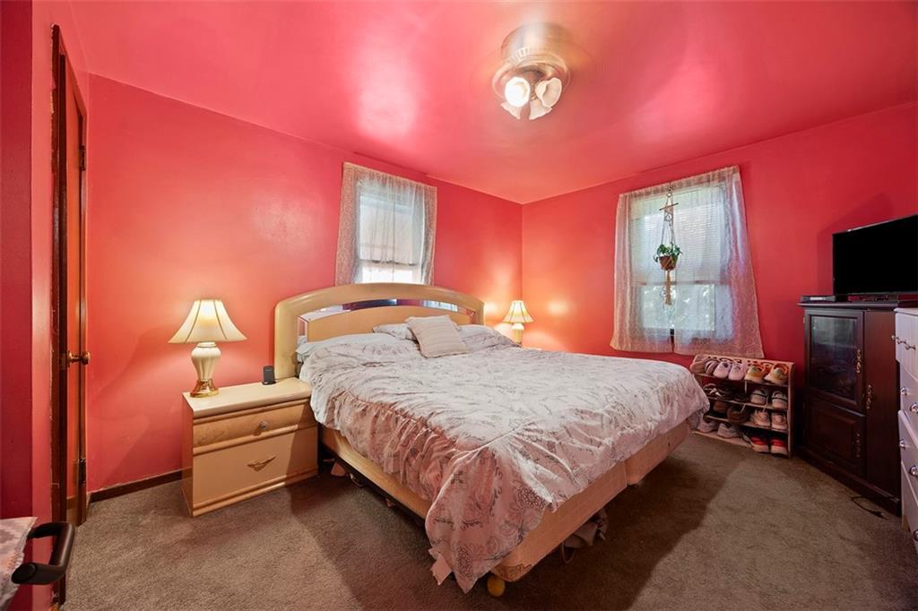 1421 Fleming Avenue McKees Rocks, PA 15136 - Photo 16 of 36 a bedroom with a bed and a flat screen tv