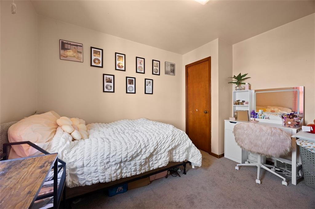 1421 Fleming Avenue McKees Rocks, PA 15136 - Photo 19 of 36 a bedroom with a bed and chair