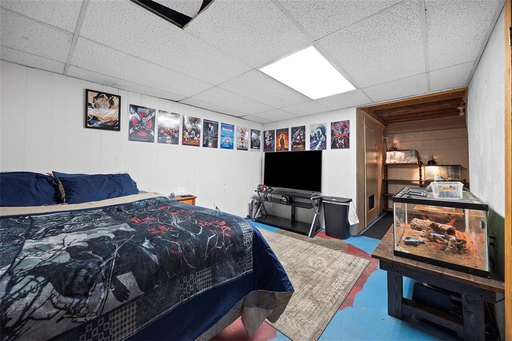 1421 Fleming Avenue McKees Rocks, PA 15136 - Photo 20 of 36 a bedroom with a bed and a flat screen tv