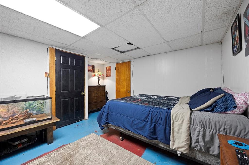 1421 Fleming Avenue McKees Rocks, PA 15136 - Photo 21 of 36 a bedroom with a bed and a dresser next to a window