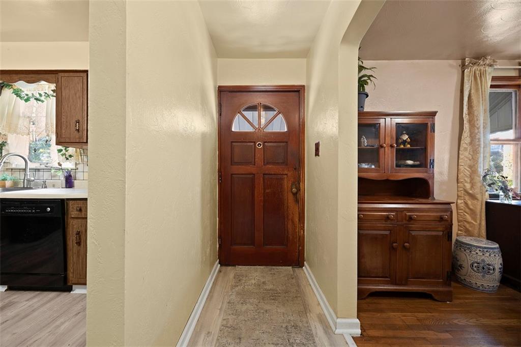 1421 Fleming Avenue McKees Rocks, PA 15136 - Photo 3 of 36 a view of hallway with mirror and a wooden floor