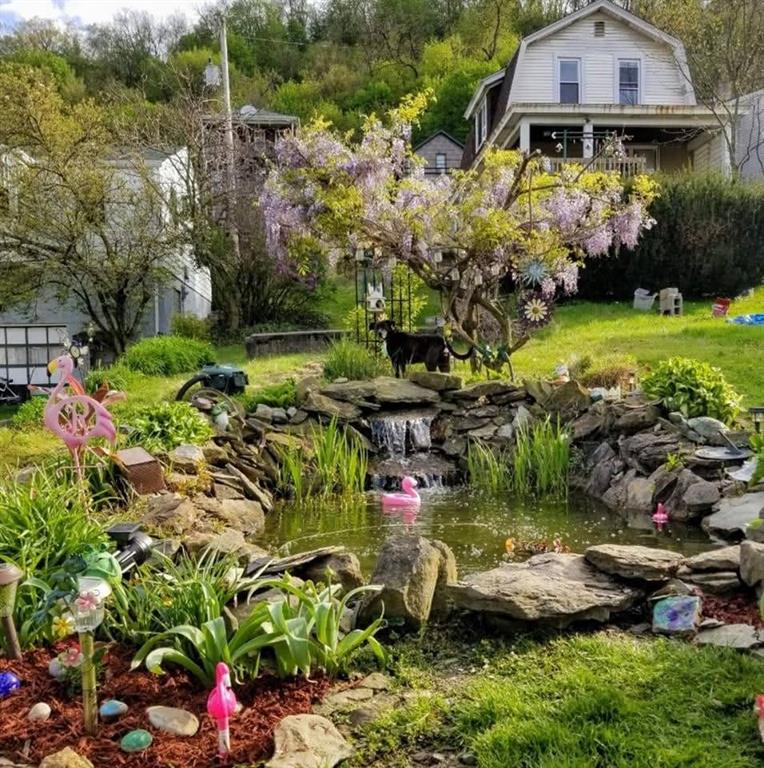 1421 Fleming Avenue McKees Rocks, PA 15136 - Photo 33 of 36 a view of a garden with flowers