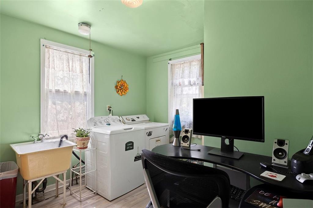 1421 Fleming Avenue McKees Rocks, PA 15136 - Photo 10 of 36 a room with furniture and a flat screen tv