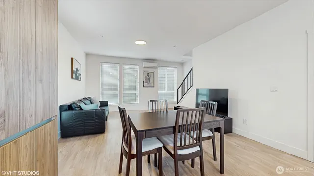 a dining room with furniture and window