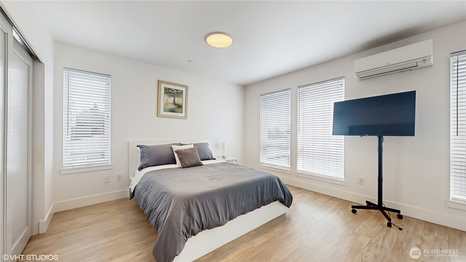 444 13th Avenue Seattle, WA 98122 - Photo 17 of 36 a bedroom with a bed and a flat screen tv