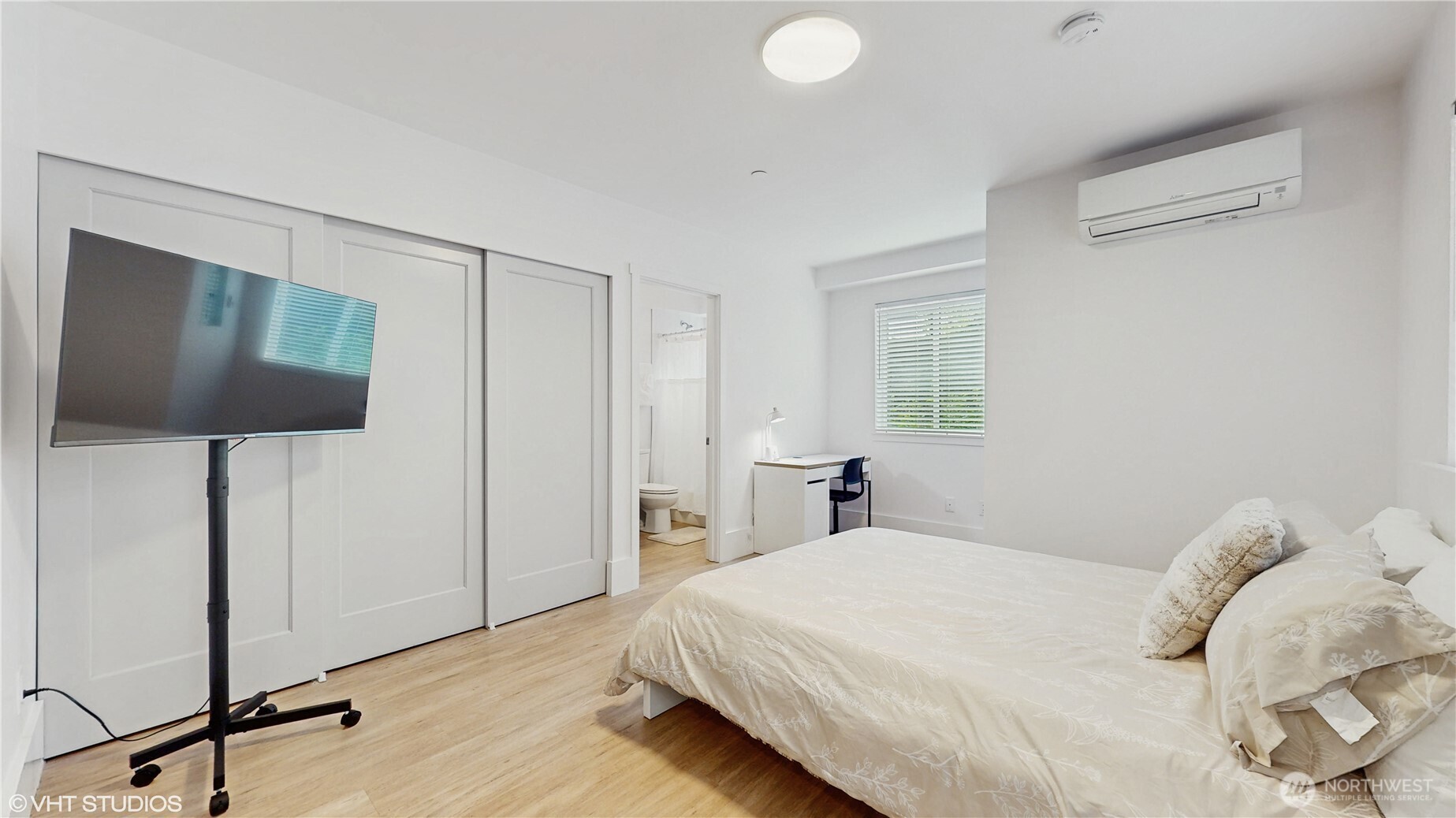 444 13th Avenue Seattle, WA 98122 - Photo 25 of 36 a bedroom with a bed and a flat screen tv