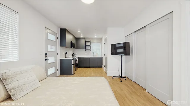 a kitchen with stainless steel appliances a refrigerator sink and microwave