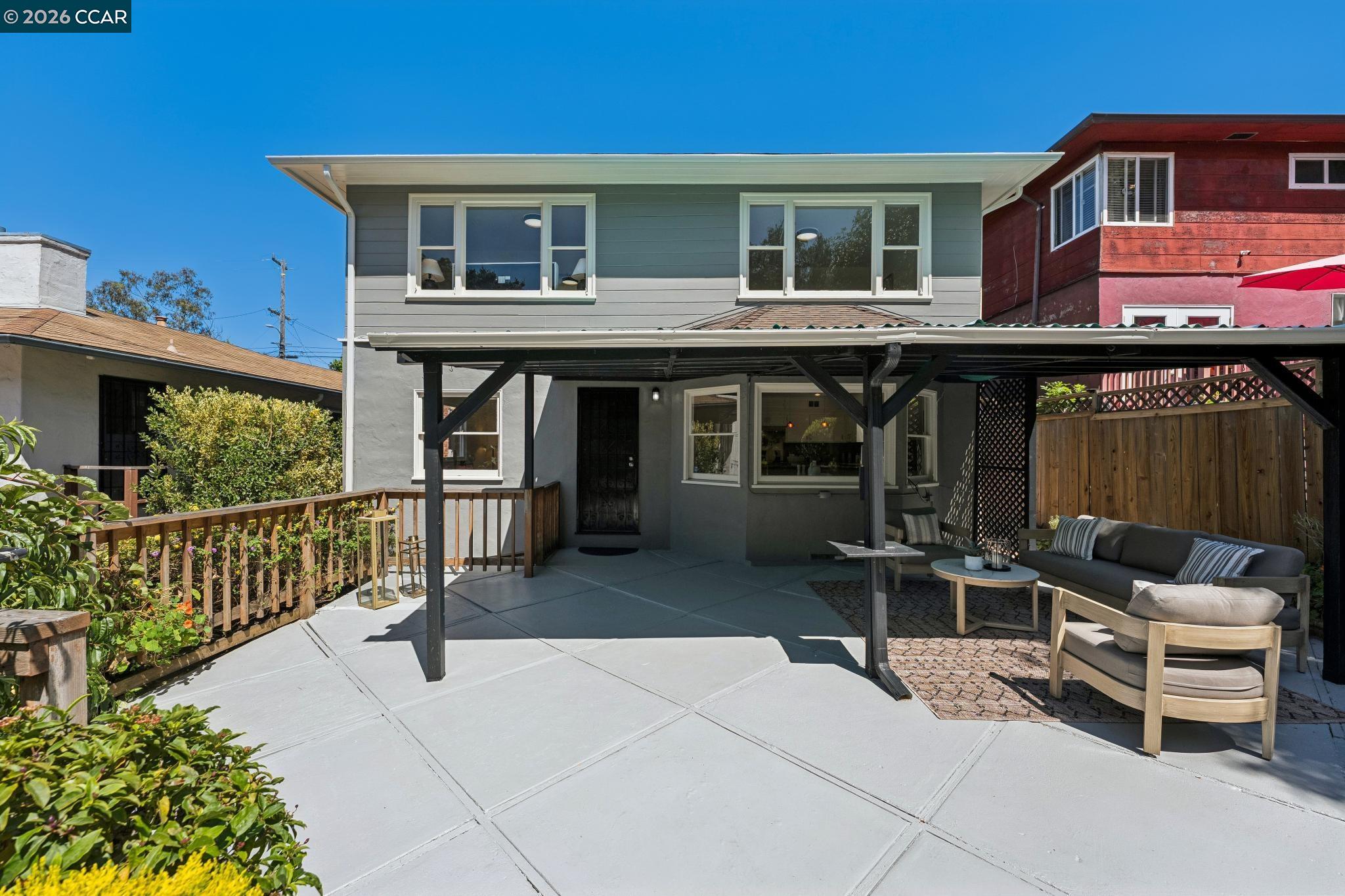 4034 Rusting Avenue Oakland, CA 94605 - Photo 38 of 52 a patio with a table and chairs and potted plants