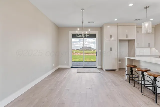 a spacious bathroom with a double vanity sink mirror and double