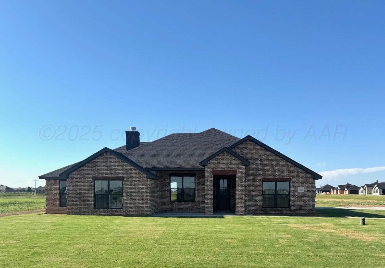 19100 Buck Springs Road Amarillo, TX 79119 - Photo 2 of 29 a front view of a house with a garden
