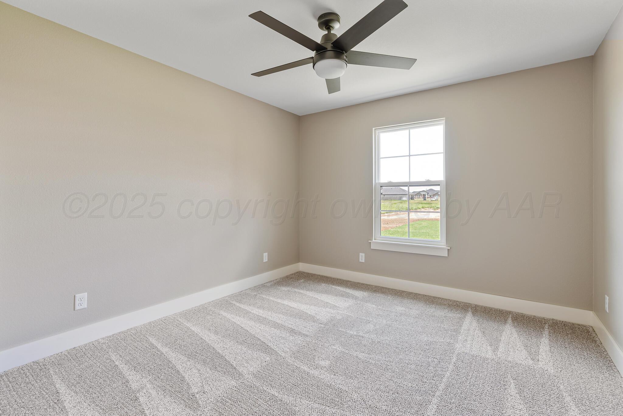 19100 Buck Springs Road Amarillo, TX 79119 - Photo 26 of 29 an empty room with a window and a fan