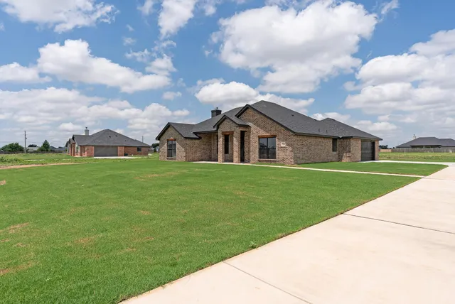 a front view of house with garden