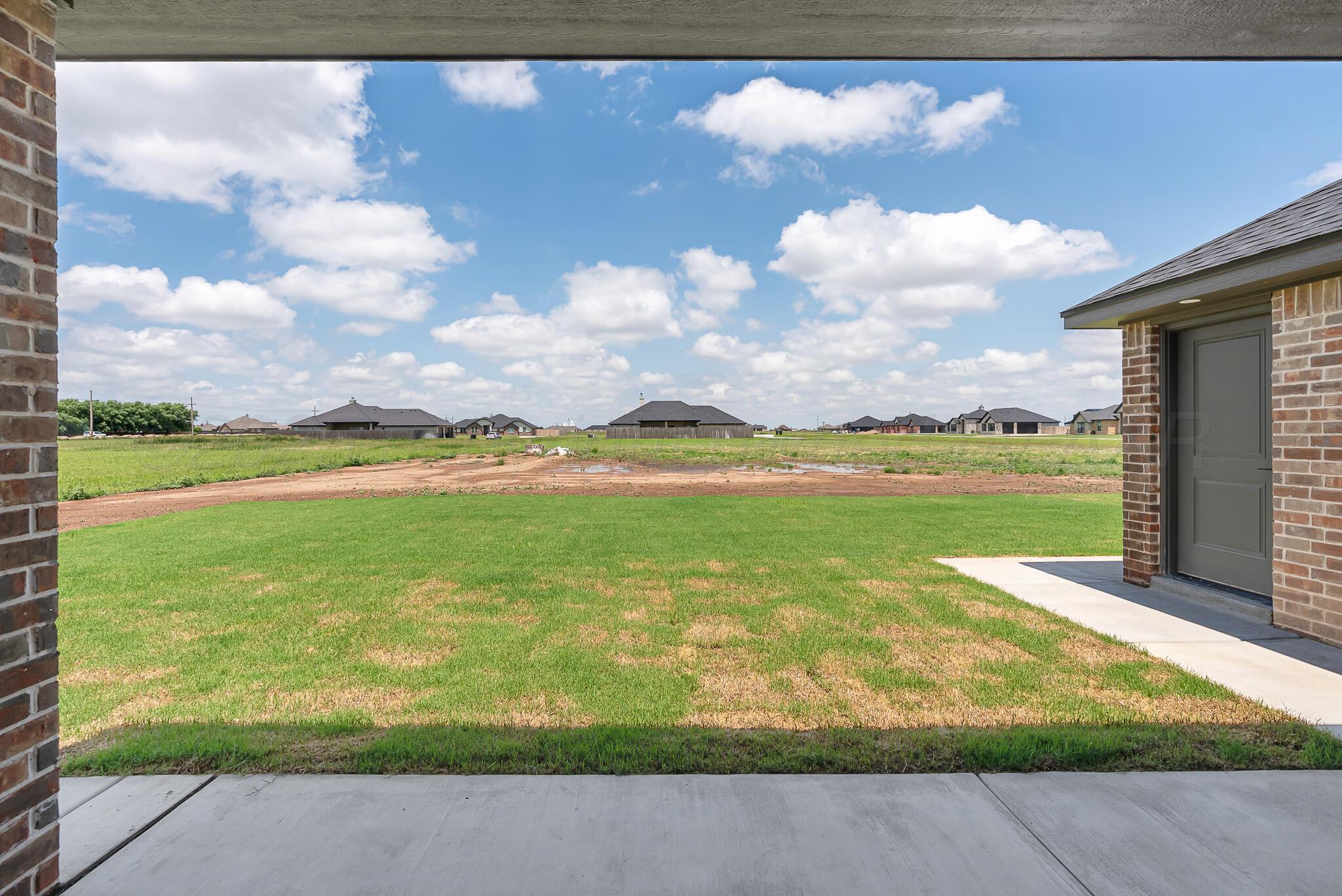 19100 Buck Springs Road Amarillo, TX 79119 - Photo 6 of 29 a view of a lake with a big yard