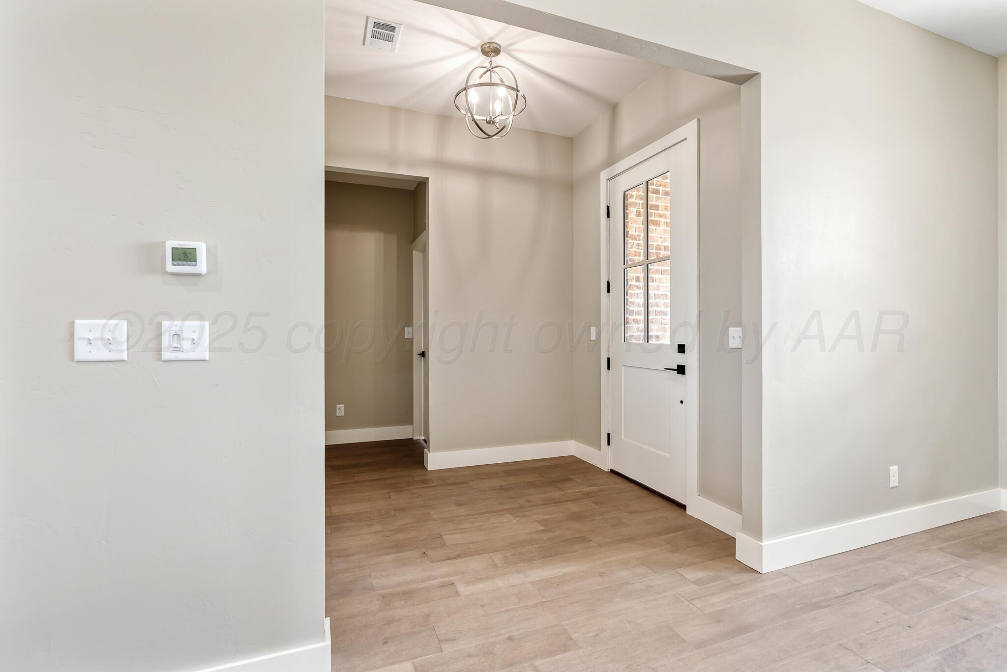 19100 Buck Springs Road Amarillo, TX 79119 - Photo 9 of 29 an empty room with windows and ceiling fan