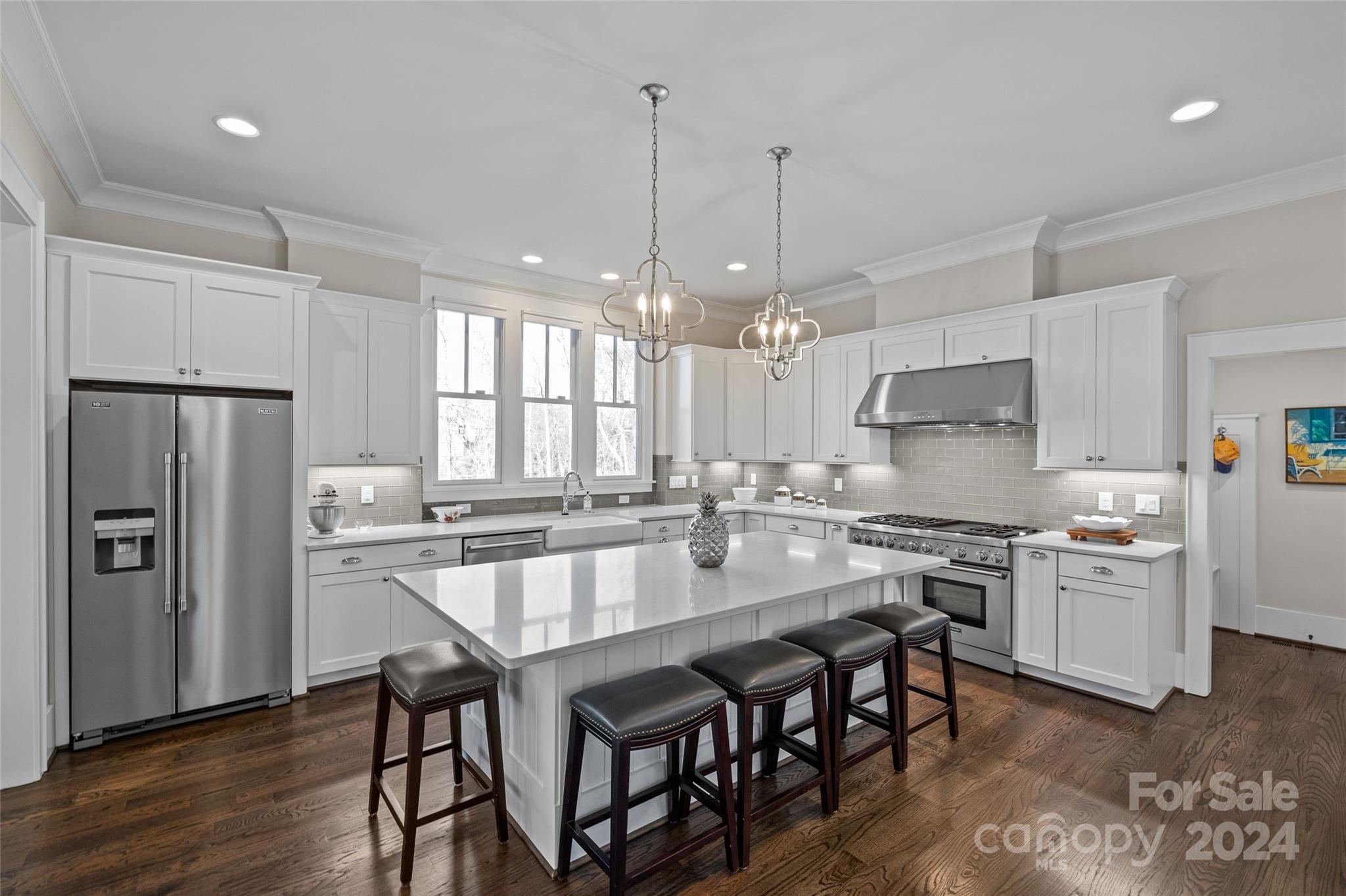 5629 Closeburn Road Charlotte, NC 28210 - Photo 17 of 44 a large kitchen with a table and chairs