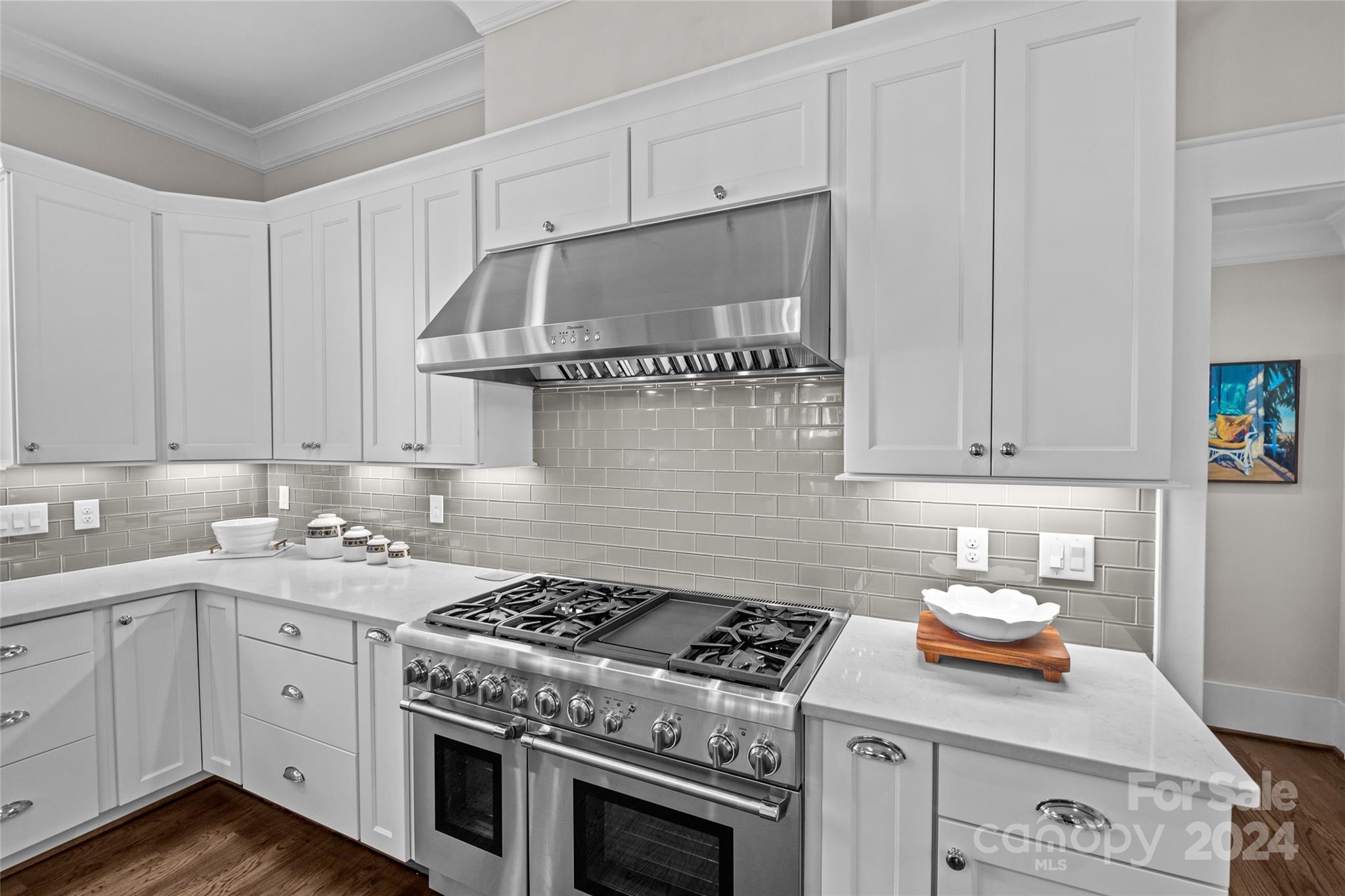 5629 Closeburn Road Charlotte, NC 28210 - Photo 19 of 44 a kitchen with a stove and a white cabinets