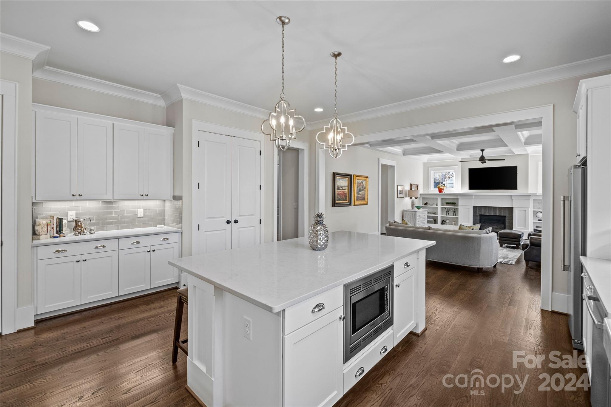 5629 Closeburn Road Charlotte, NC 28210 - Photo 20 of 44 a kitchen with a sink stove and wooden floor