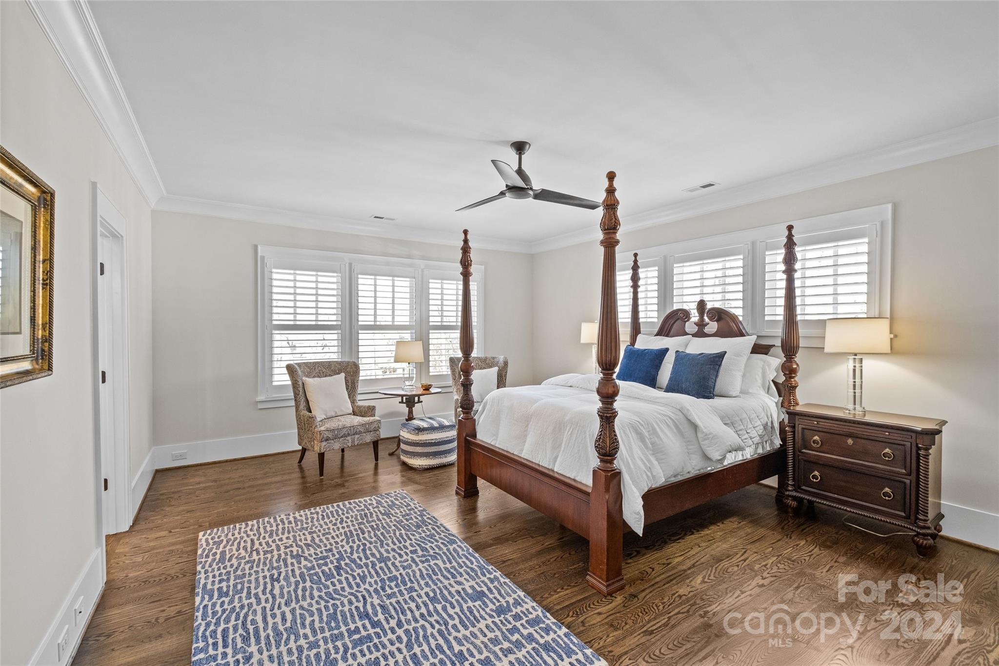 5629 Closeburn Road Charlotte, NC 28210 - Photo 28 of 44 a bedroom with a bed and wooden floor