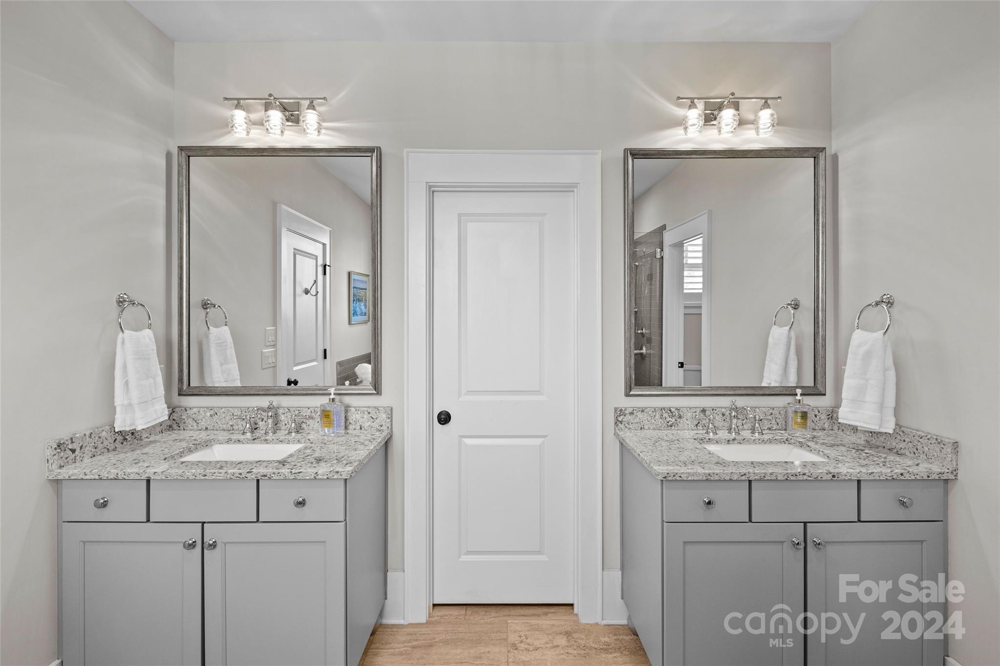 5629 Closeburn Road Charlotte, NC 28210 - Photo 30 of 44 a bathroom with a granite countertop sink and a mirror