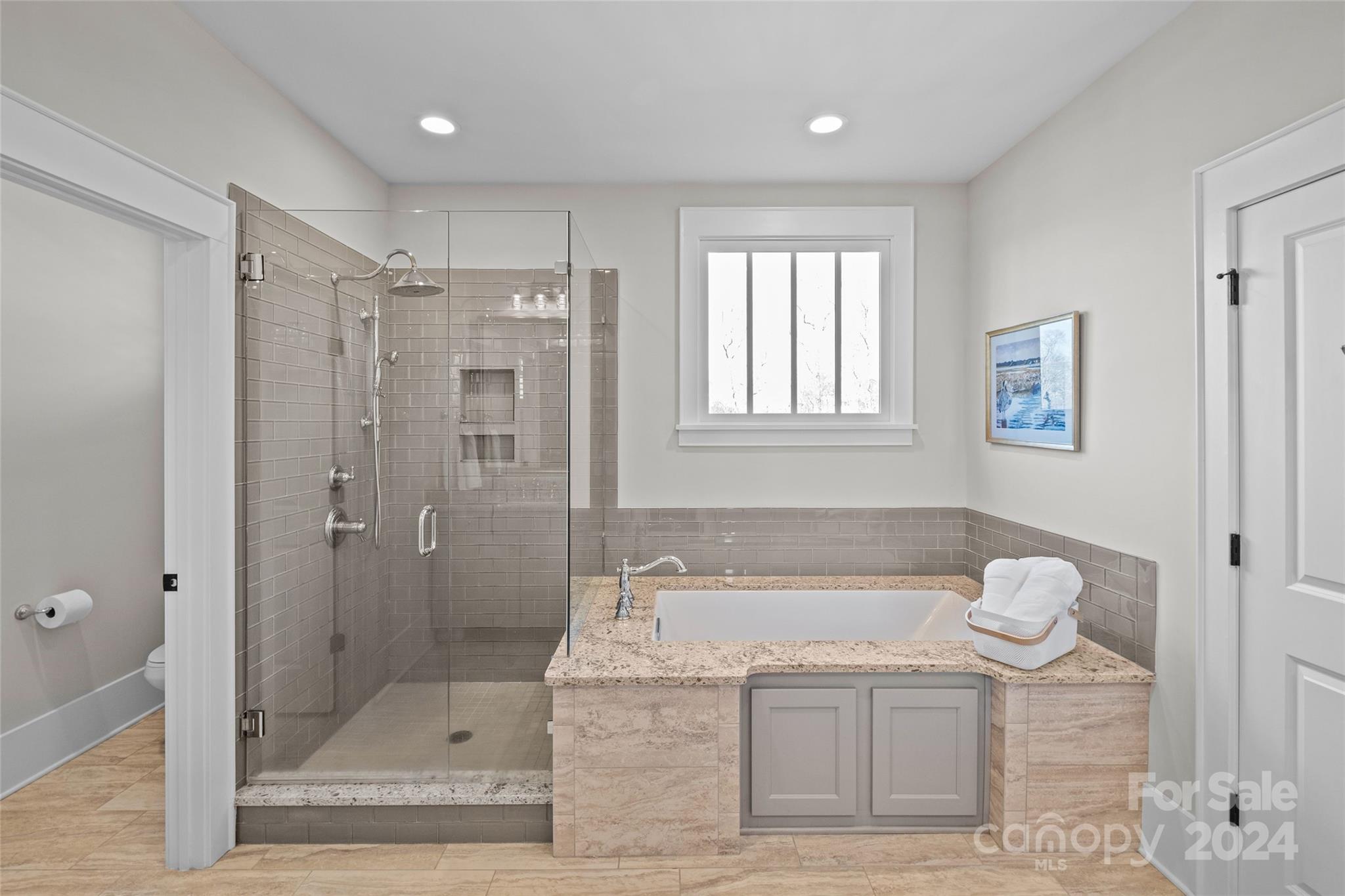 5629 Closeburn Road Charlotte, NC 28210 - Photo 31 of 44 a bathroom with a granite countertop sink a toilet and shower