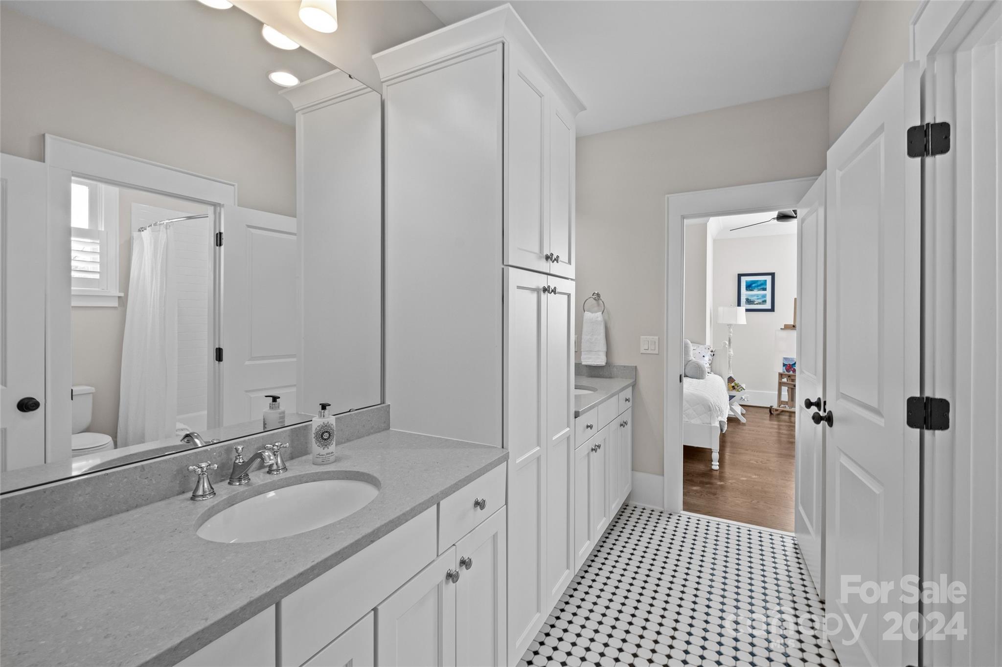 5629 Closeburn Road Charlotte, NC 28210 - Photo 33 of 44 a bathroom with a double vanity sink and mirror